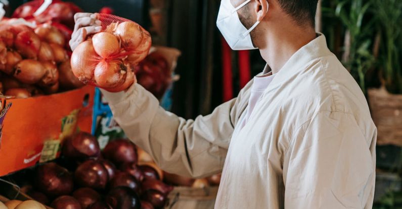 Safe Options - Ethnic man choosing goods in grocery market