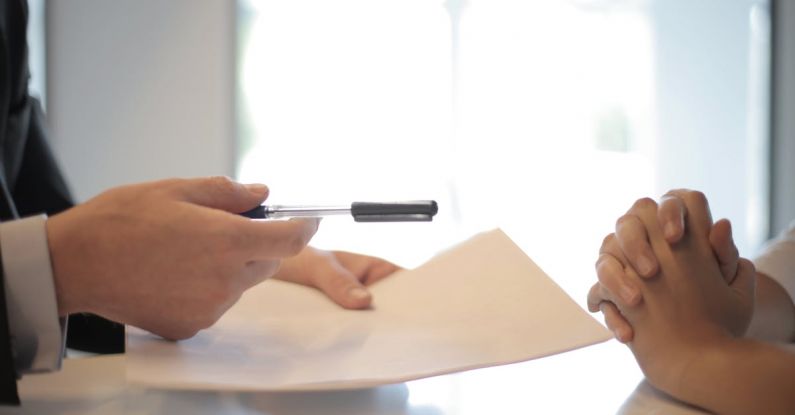 Custom-Made Furniture - Crop businessman giving contract to woman to sign