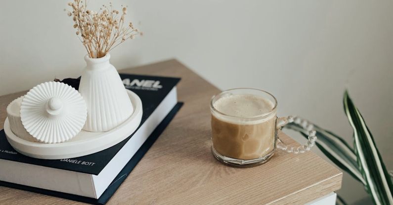 Upcycled Furniture - A Cup of Coffee Standing next to Decorations on a Dresser