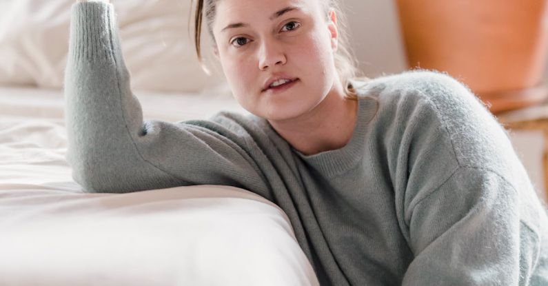 Raised Beds - Young woman with ponytail in hand