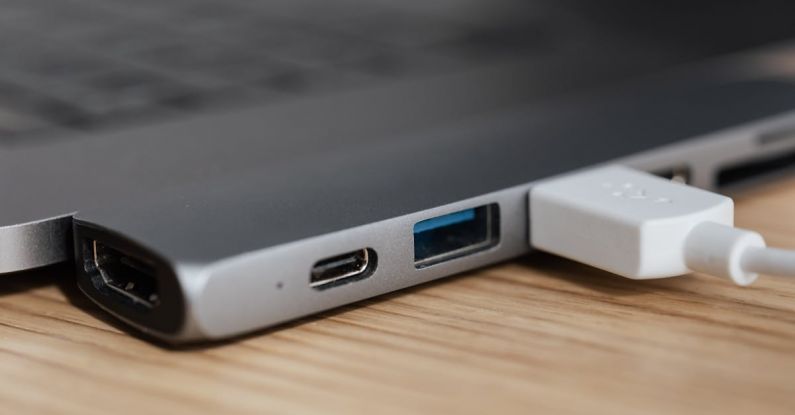 Smart Plugs - USB type c multiport adapter with plugged white cable connected to modern laptop