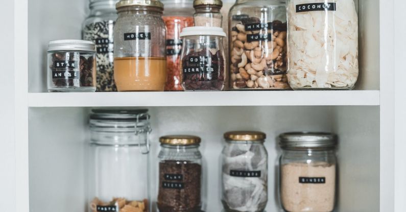 Zero-Waste Kitchen - Clear Glass Jars on White Wooden Shelf