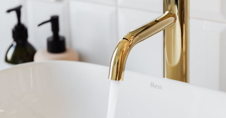 Water-Saving Fixtures - Gold Faucet in Close Up Photography